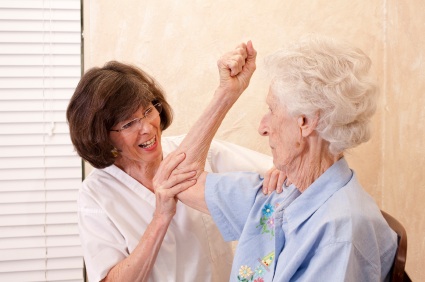A physiotherapist visiting an older woman